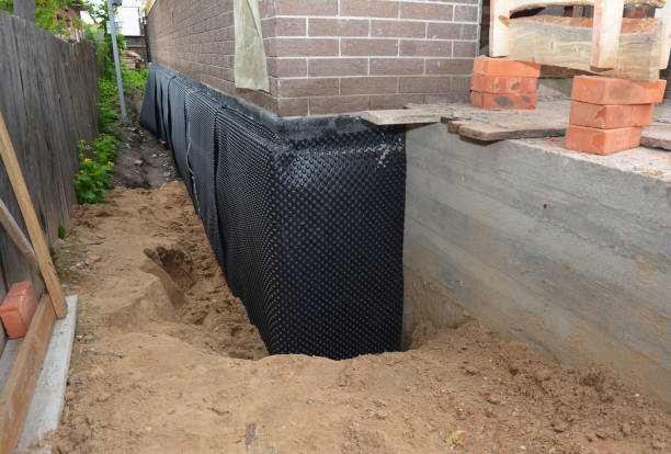 SJ Waterproofing Pros technician performing targeted Basement Waterproofing assessment in Victoria, VA
